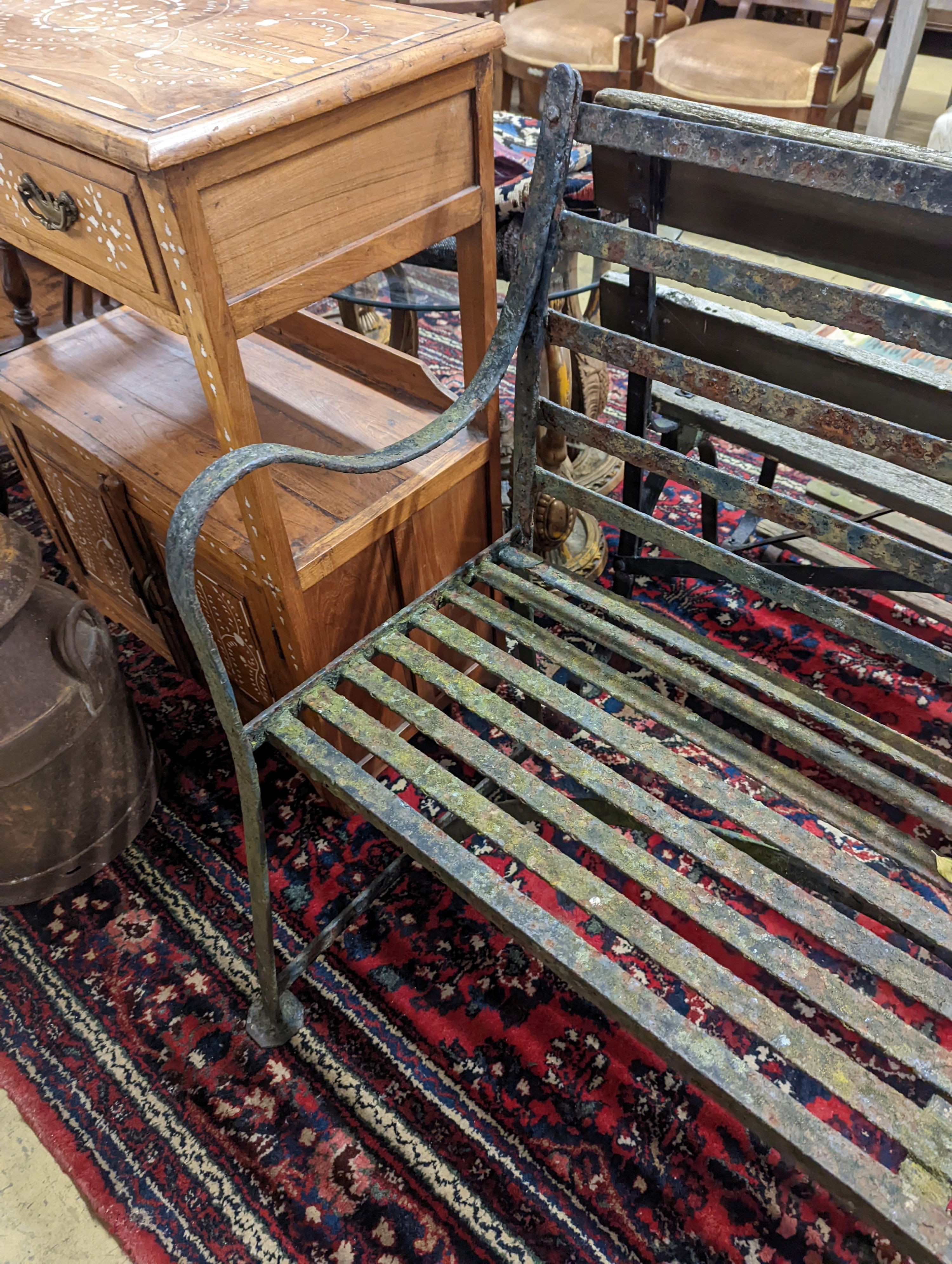 A 19th century painted wrought iron garden bench, length 122cm, depth 44cm, height 92cm